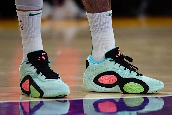 Boston Celtics forward Jayson Tatum's green and black Jordan Brand shoes.